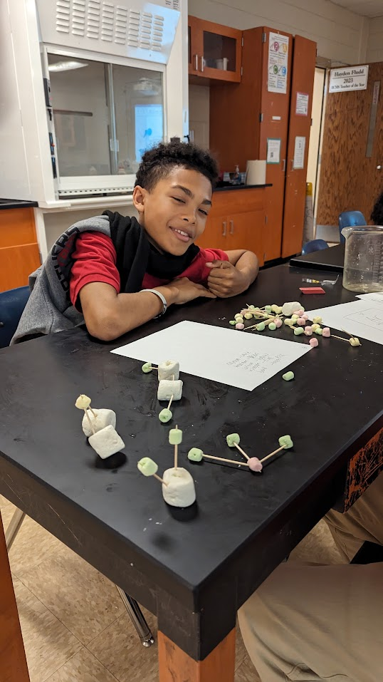 Student building a scientific model